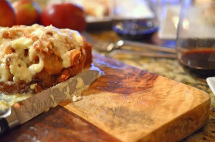 A piece of bread sitting on top cutting board.