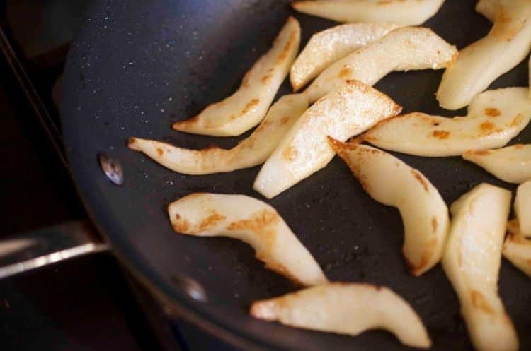 A close up of pears in a pan.