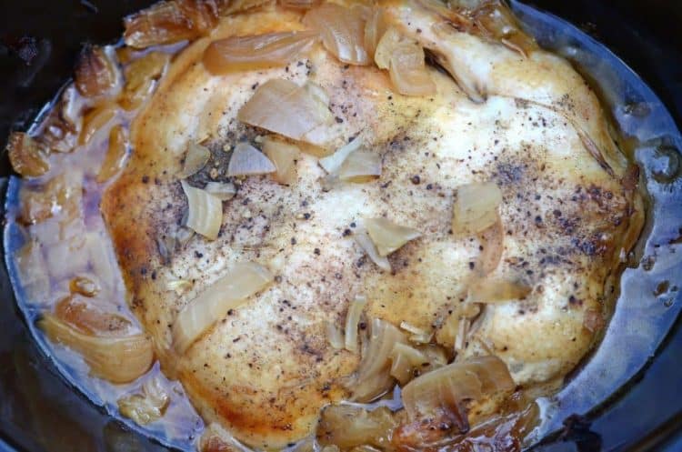 A close up of a pan with onions.