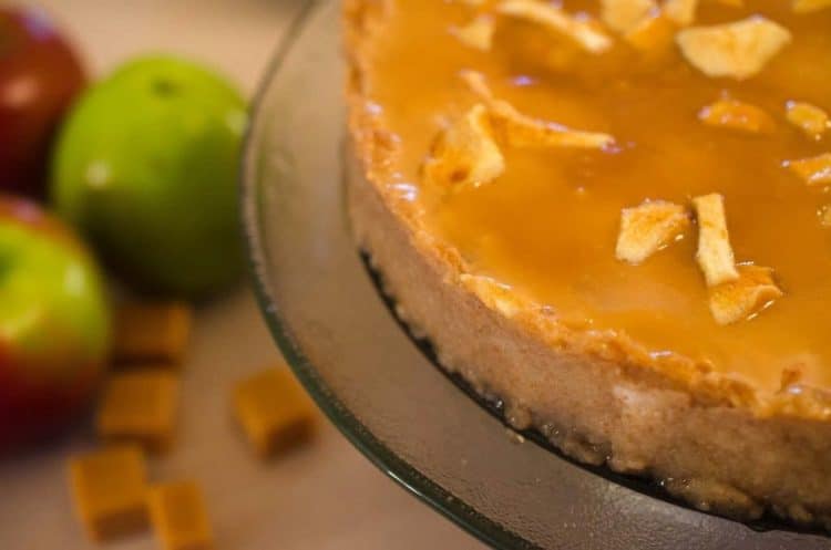 A close up of a caramel apple cheesecake.