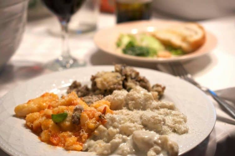 A plate of Gnocchi and vegetables.