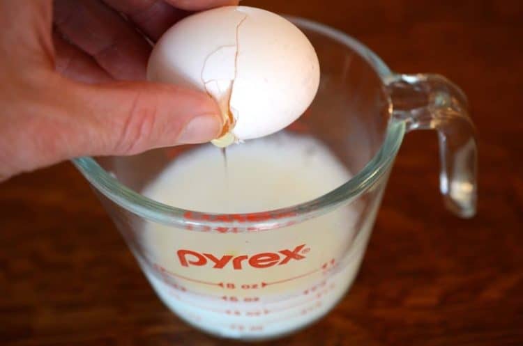 measuring cup with milk and eggs