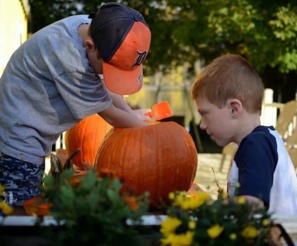 boys with a pumpkin.