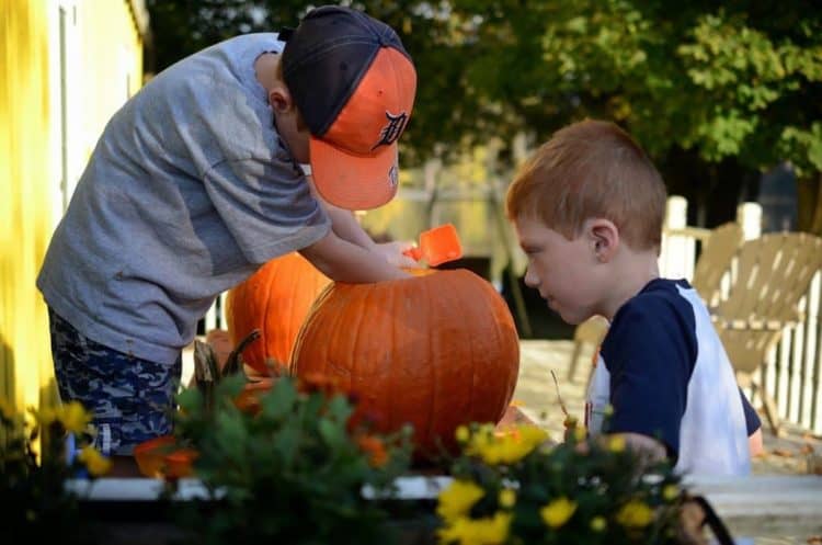 boys with a pumpkin.