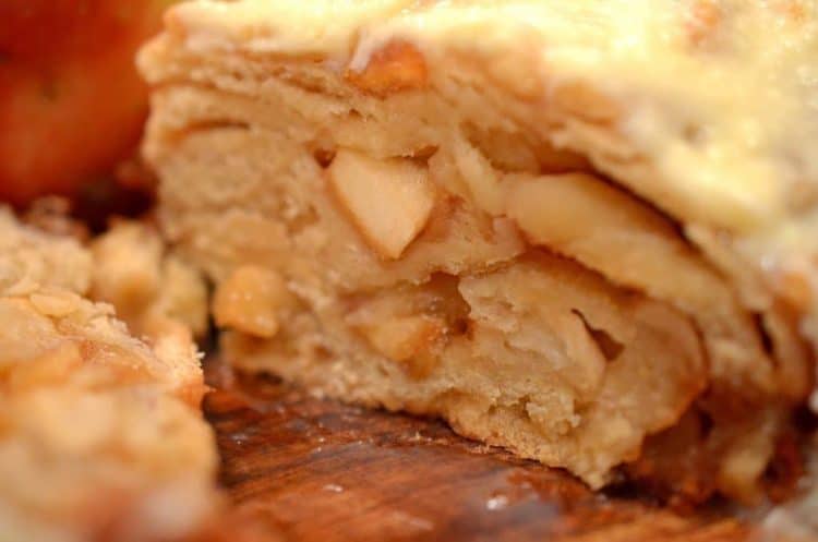 A close up of a cross section of apple bread,