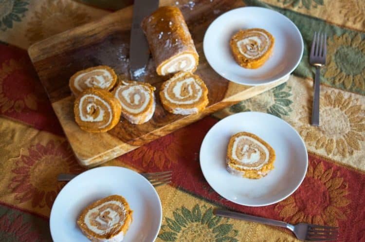 A plate of food and a cup of coffee, with Pumpkin cake roll