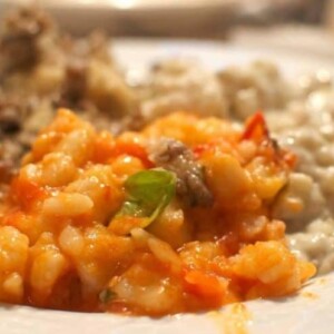 A close up of a plate of Gnocchi.