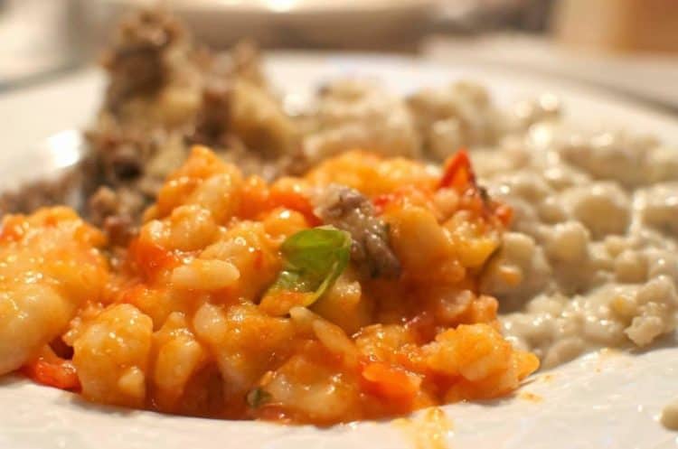 A close up of a plate of Gnocchi.