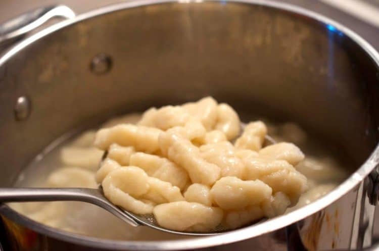 Homemade gnocchi on a spoon.