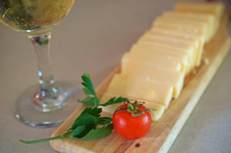 A plate of sliced cheese.