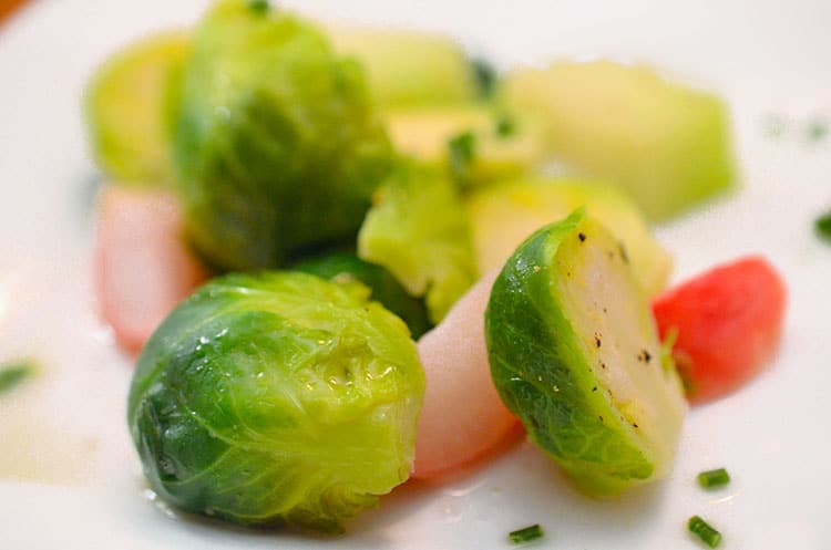 A plate of food with Brussels sprouts