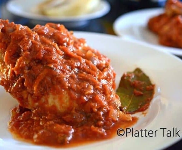 A close up of chicken Cacciatore on a plate.