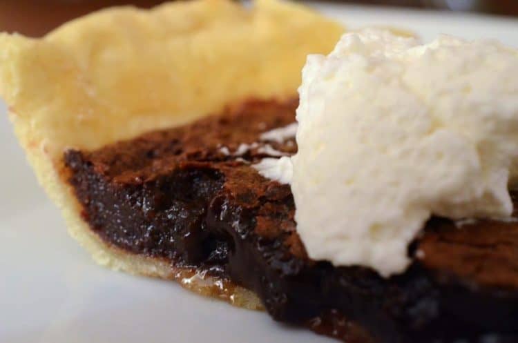 A close up of a piece of chocolate cherry pie