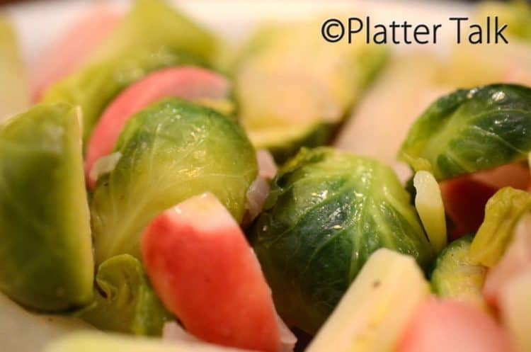 A closeup of Brussels sprouts and radishes