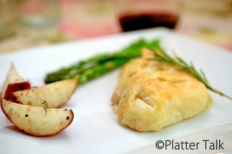 A close up of a plate of food, with Pork and Puff pastry