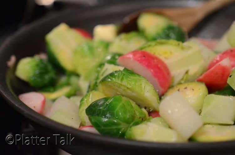 Saute pan of braised vegetables.