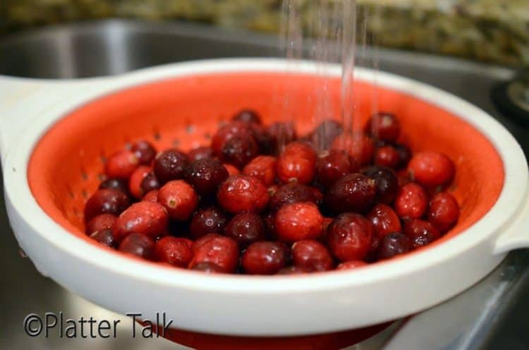 a strainer of cranberries
