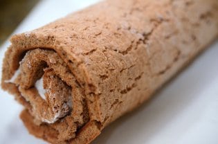 A close up of a rolled sheet cake.
