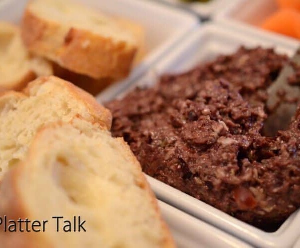 A piece of bread with dip.