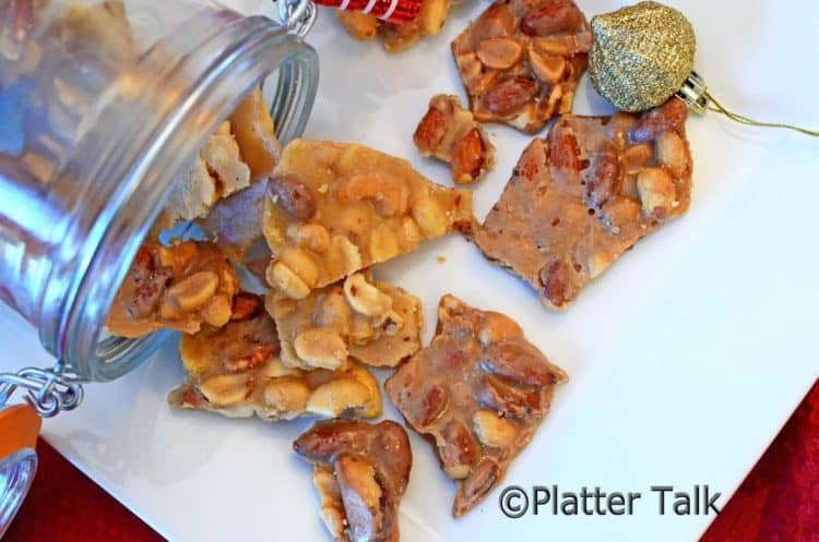 pieces peanut brittle on a plate.