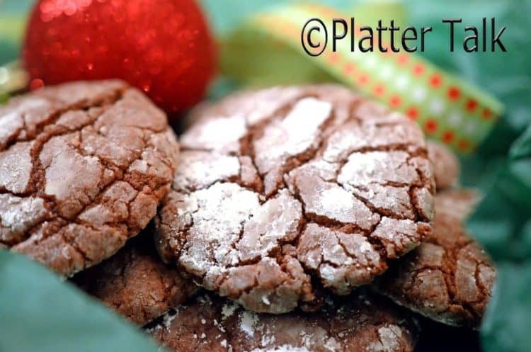A stack of fudge crinkle cookies on a plate.