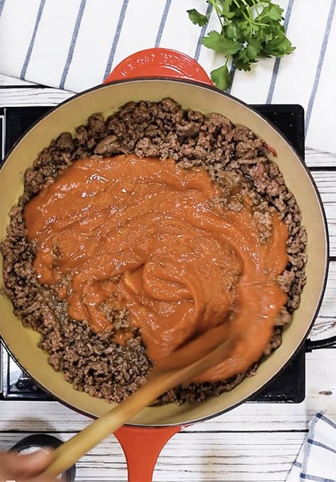 Preparing homemade beefaroni.