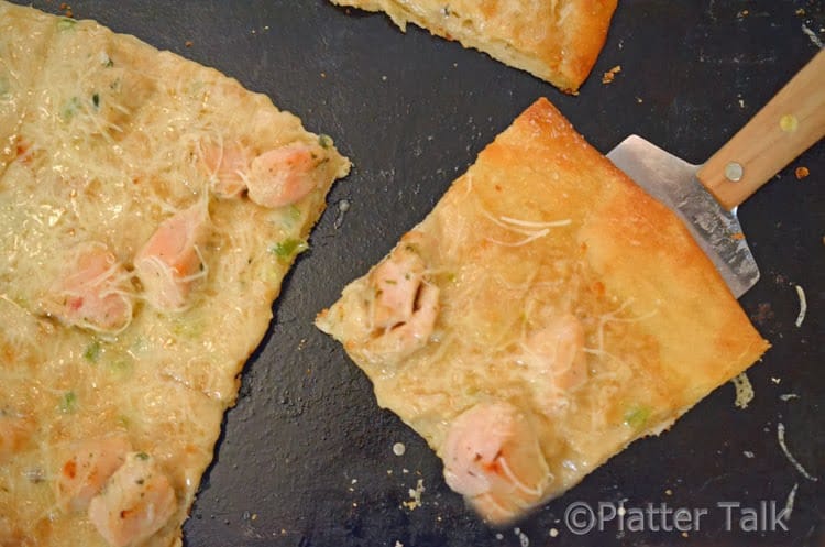 a slice of pizza on a spatula 