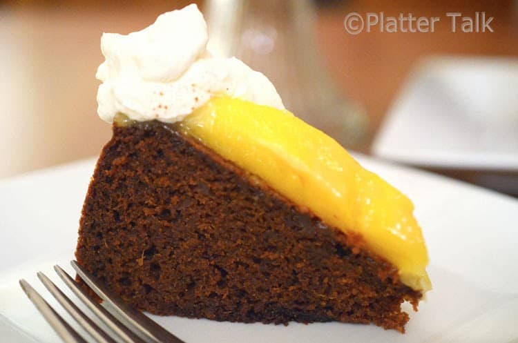 a slice of ginger cake with mango