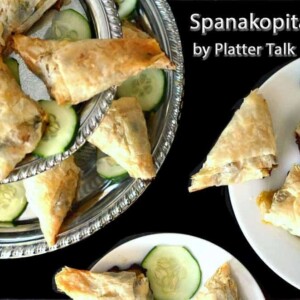 A bunch of food on a plate, with cucumber.