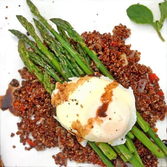 A plate of food with asparagus and egg.