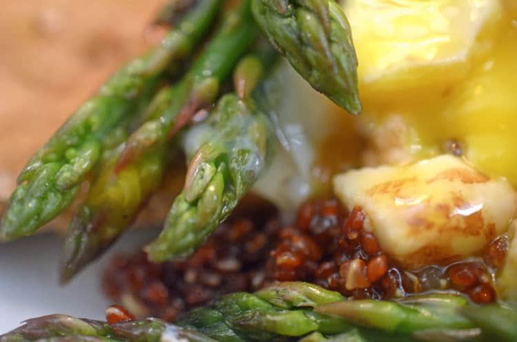 A plate of food with asparagus.