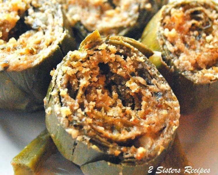 A close up of food with Artichokes and Garlic.