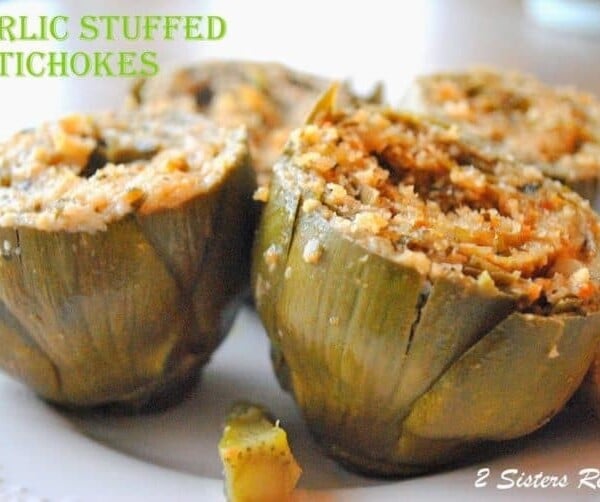 A close up of a plate stuffed artichoke.