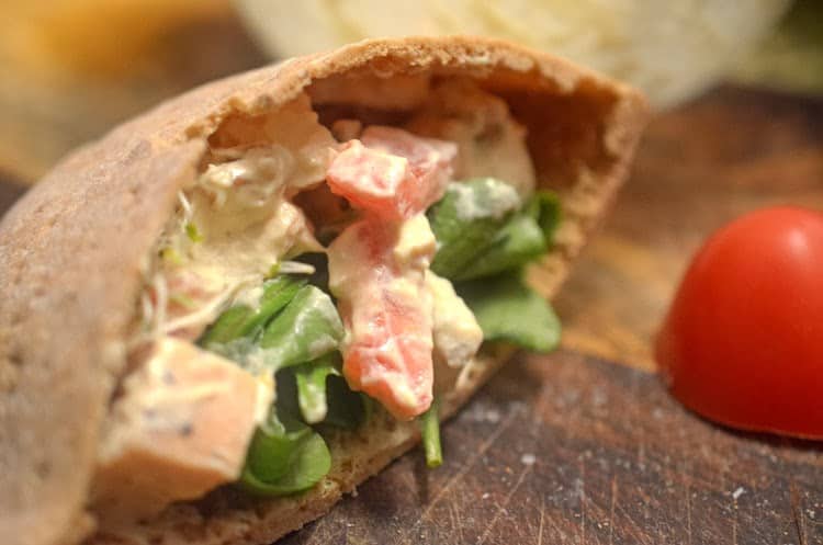 A close up of a chicken pita sandwich