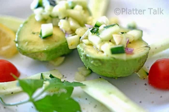 Salad atop split avocado with cilntro