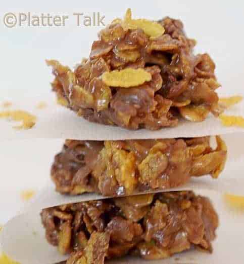 A stack of three Peanut Butter and Chocolate Cornflake Cookies