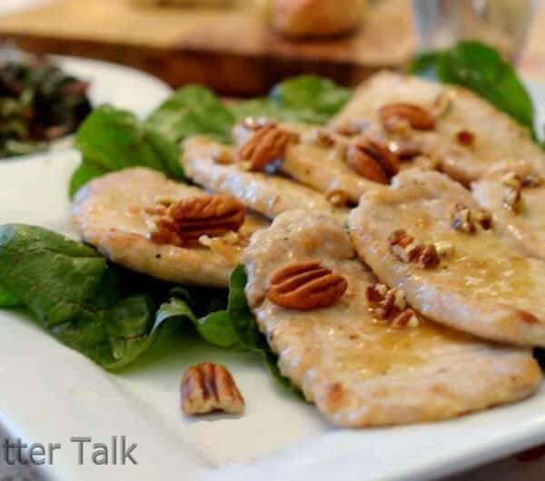 a plate of honey pecan pork chops