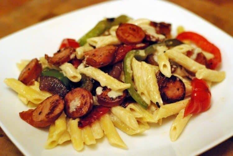 smoked sausage penne alfredo on a plate