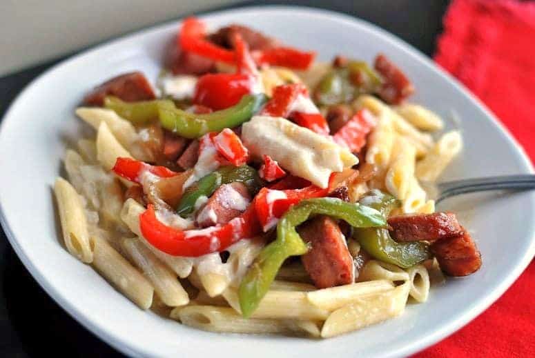 A plate of food, with Sausage and Penne