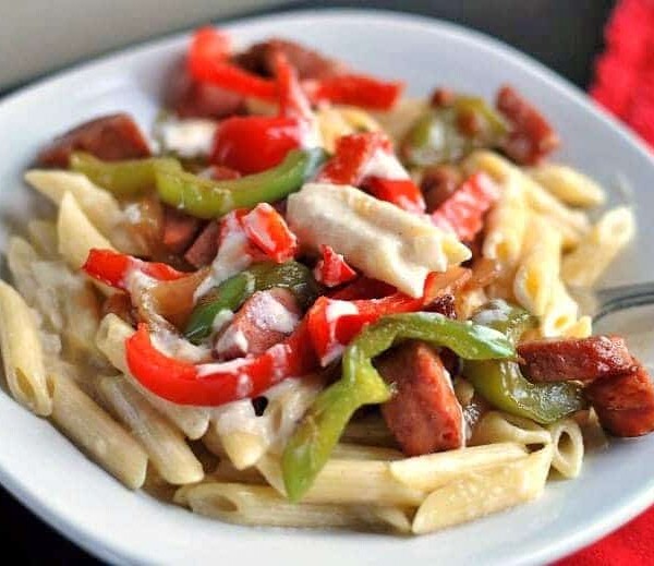 A plate of smoked sausage penne alfredo