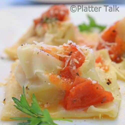 a close up of wonton wrapped sausage and ricotta ravioli