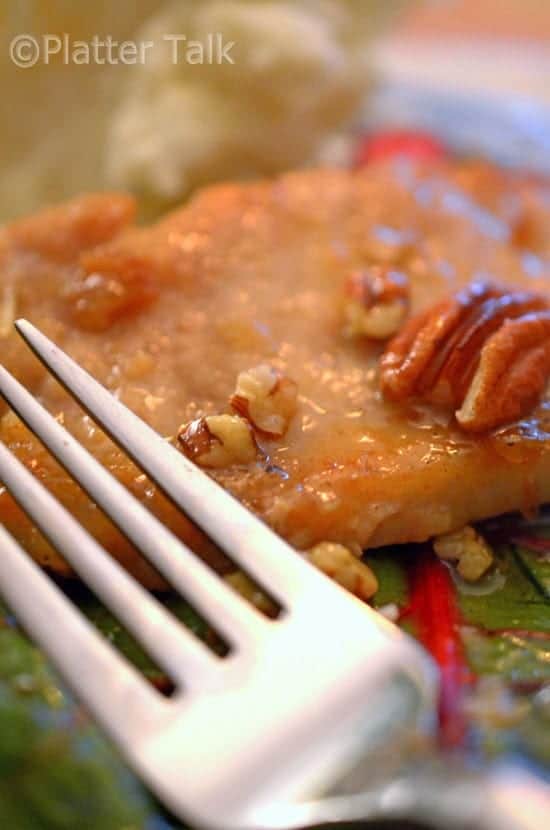 A close-up of a plate of food, with Pork and Pecan.
