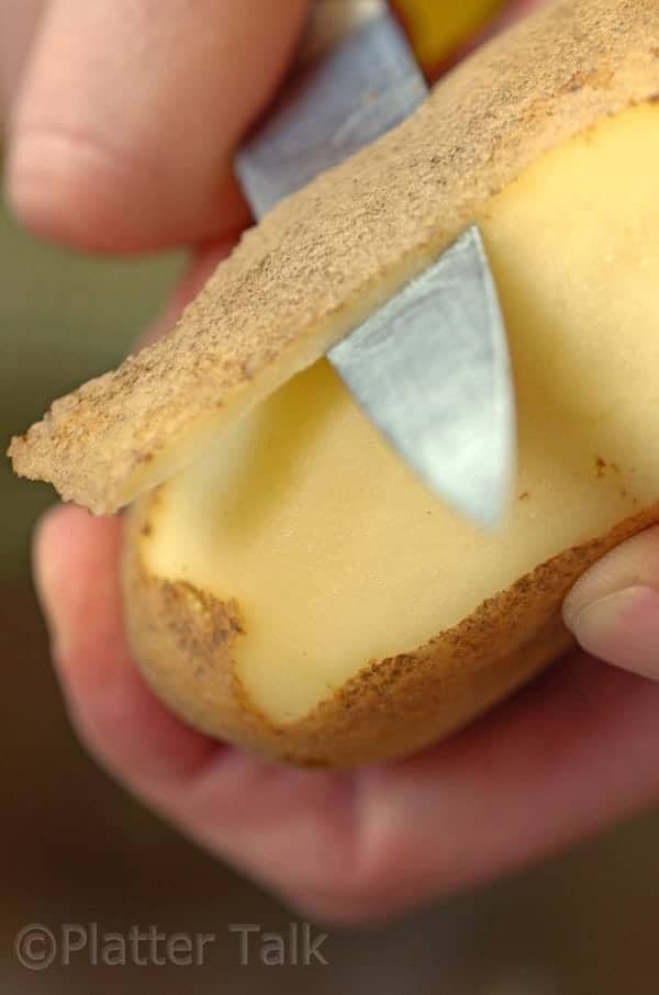 a potato getting peeled