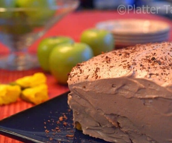 A close up of a chocolate cake sitting on top of a table