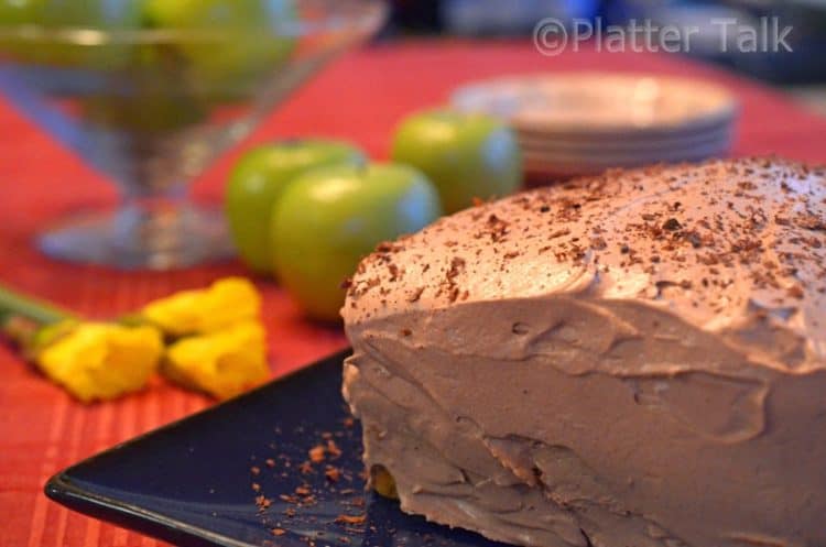 A close up of a chocolate cake sitting on top of a table