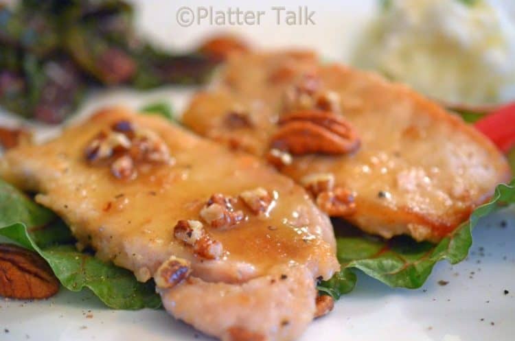 A close up of a honey pecan pork chop