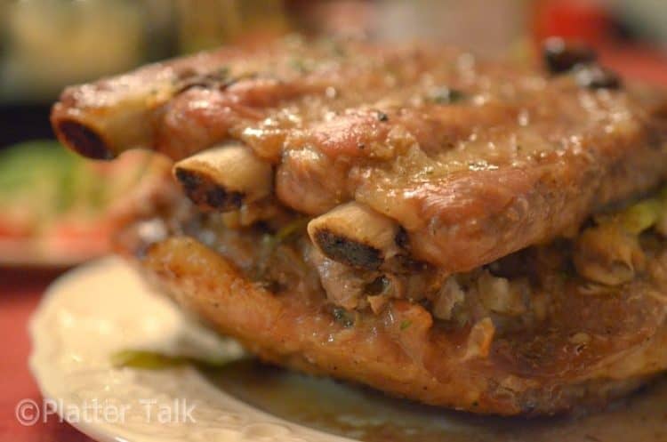 A close up of a baked sparerib sandwich