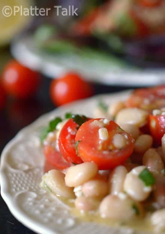 a white bean cherry tomato salad on a plate