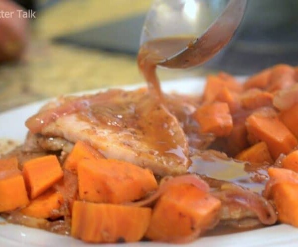 A plate of pork and sweet potatoes.