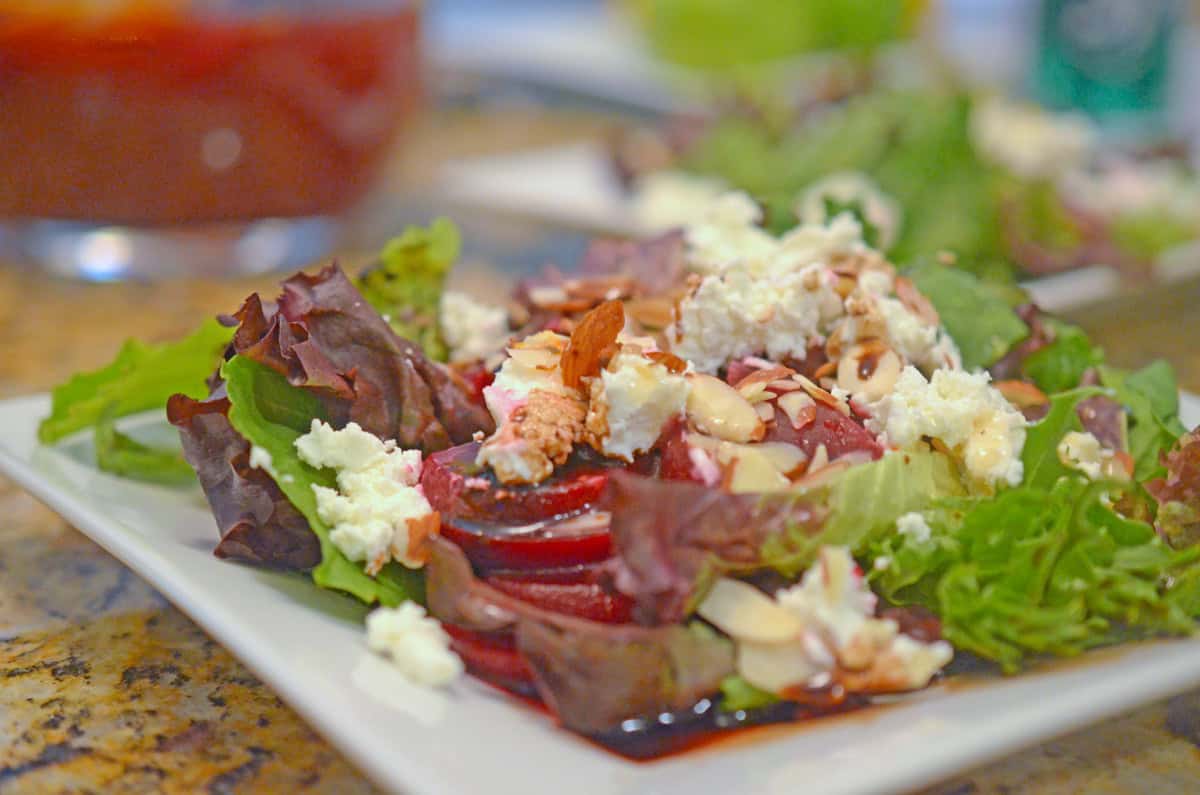 A salad with pickled beets and goat cheese.